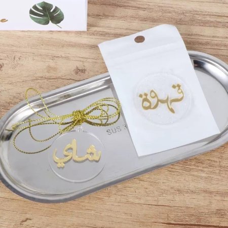 تعليقة اكرلك شفافة مع كتابة باللون الذهبي